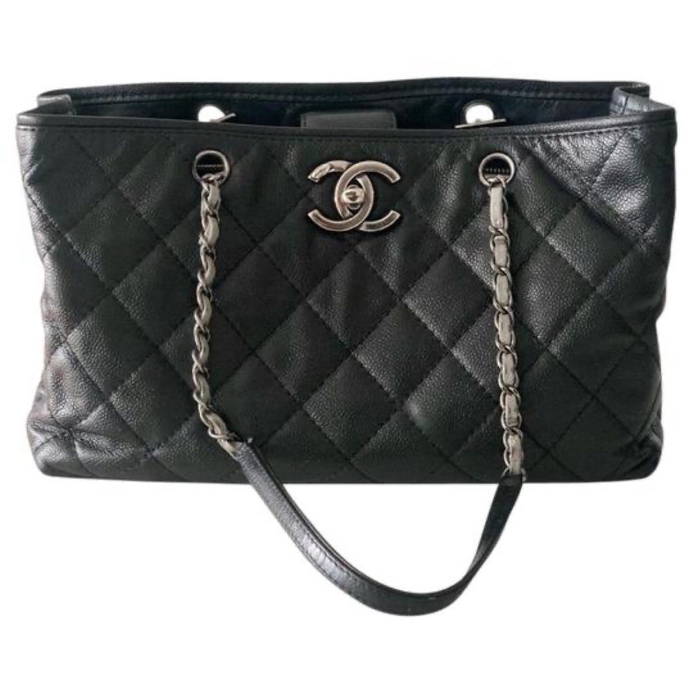 Chanel black caviar leather tote bag.